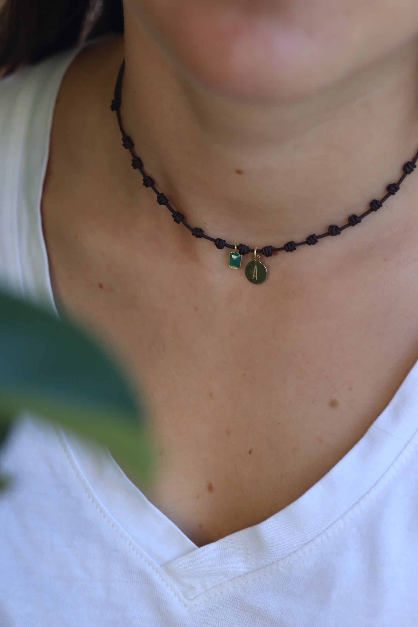 Knotted necklace with initial and mineral