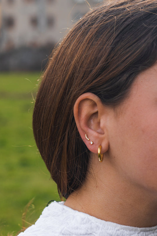 Pendientes piercing curva